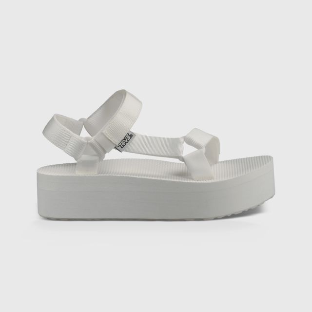 white teva flatforms