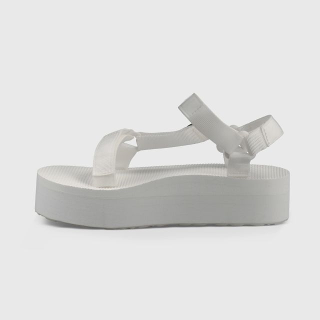 white teva flatforms